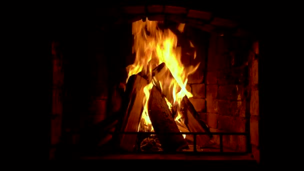 Glowing fire in home stone fireplace — Video Stock