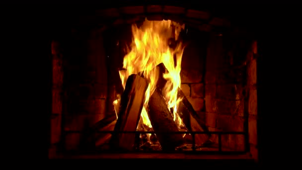 Glowing fire in home stone fireplace — Stock Video