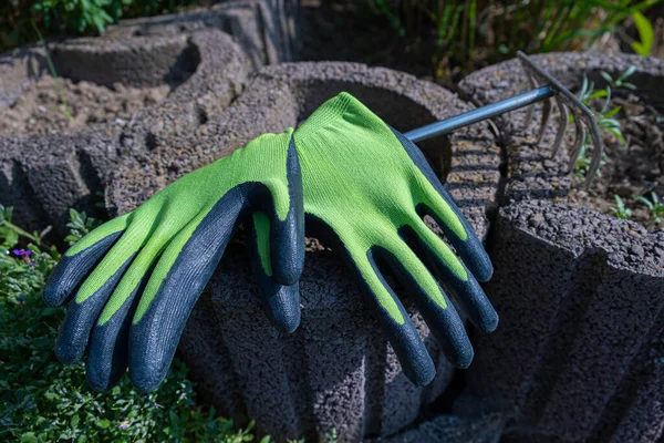 Garden work. Gloves for gardening. Gardening. Green gardening gloves
