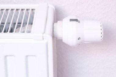 The temperature controller of the radiator of the water heating system in the living room. Close-up.