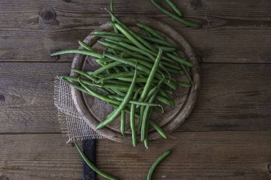 Green bean. Top view. Beans on a wooden table. High quality photo
