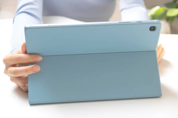 Close-up image of young professional female manager using laptop at her office, businesswoman working from home via portable computer. freelancer girl