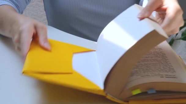 Girls Hands Holding Yellow Book Education Concept High Quality Photo — Vídeo de stock