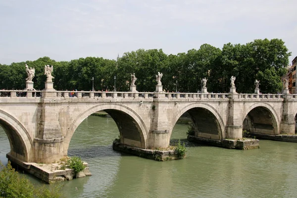 Another river with a bridge crossing the river in Rome.