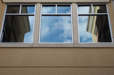 You can see the reflection of the sky in the windows of this building.