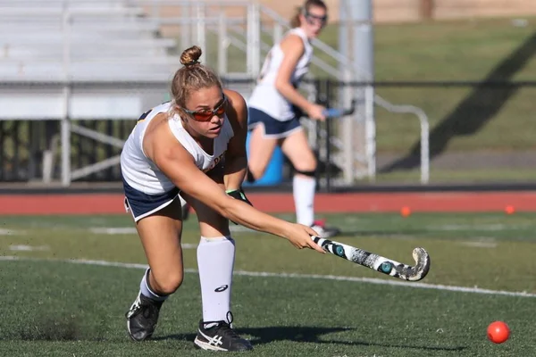 The player is taking a hard shot on  goal in this game action.