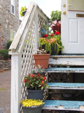 The flowers are displayed on the outside steps.