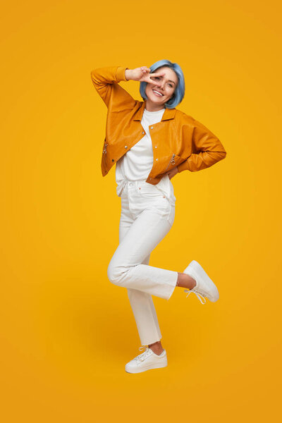 Cheerful hipster woman in trendy outfit