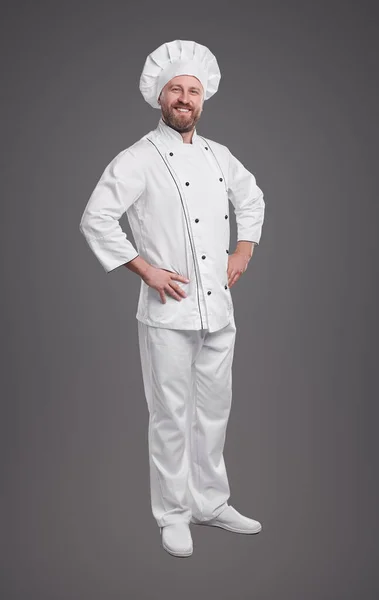 Confident chef in uniform on gray background — Stock Photo, Image