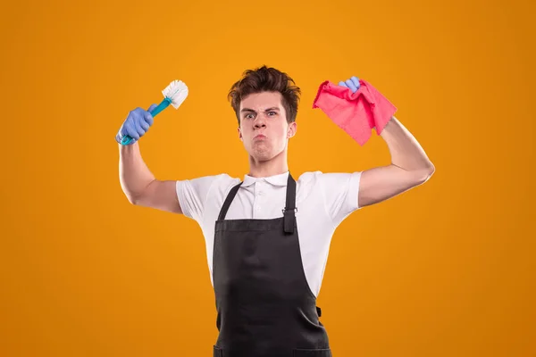 Angry housekeeper with toilet brush and rag — Stock Photo, Image