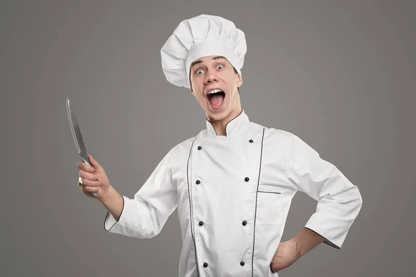 Cheerful chef with knife ready for cooking — Stock Photo, Image