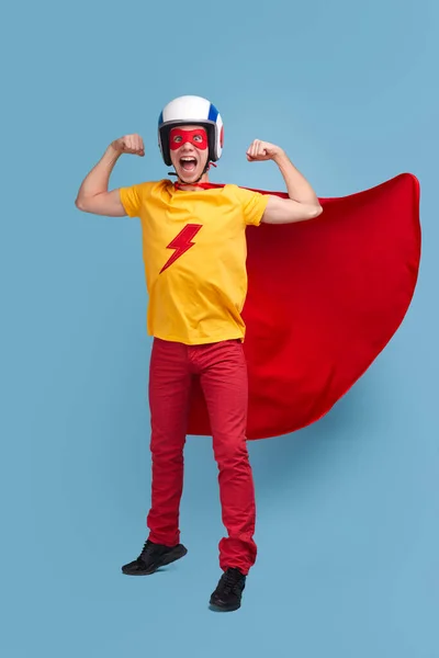 Funny Courageous Male Bright Superhero Costume Helmet Demonstrating Muscles While — Stock Photo, Image