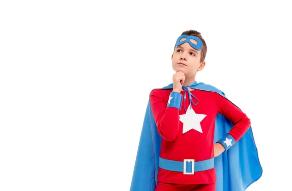 Niño reflexivo en traje de superhéroe mirando hacia otro lado — Foto de Stock