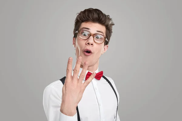 Funny geek showing number on fingers — Stock Photo, Image