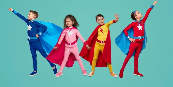 Kids with superpowers in studio — Fotografia de Stock