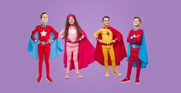 Company of superhero kids in studio — Φωτογραφία Αρχείου