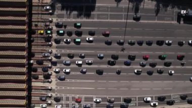 Lisbon, Portugal, August 2022. Timelapse of cars traffic jam before tolls gates. Aerial view of vehicles driving on multiple lanes and stopping at tollway to pay the tax for private road