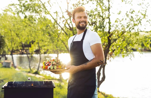 Optimistic Bearded Male Chef White Shirt Black Apron Carrying Plate — Foto de Stock