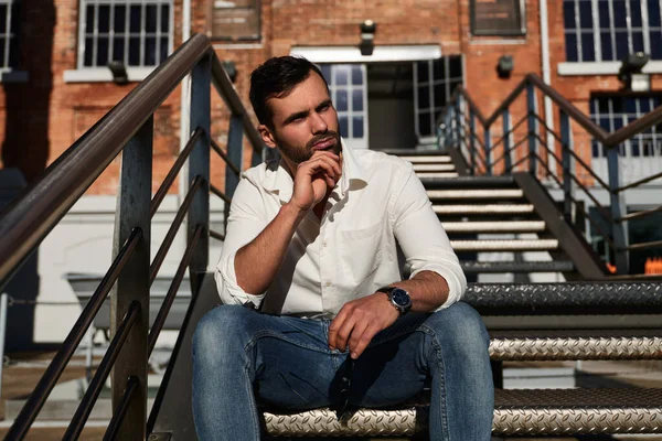 Pensive Ethnic Male White Shirt Jeans Touching Chin Looking Away —  Fotos de Stock