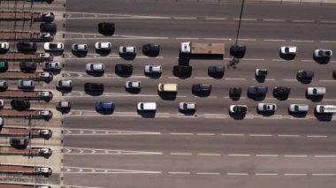 Aerial top down Timelapse of cars waiting in traffic to go through tolls on highway