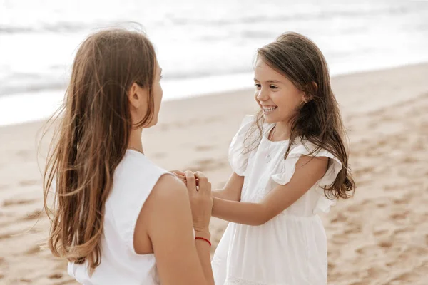 Mom Long Hair Touching Hands Happy Little Daughter White Dress — Fotografia de Stock