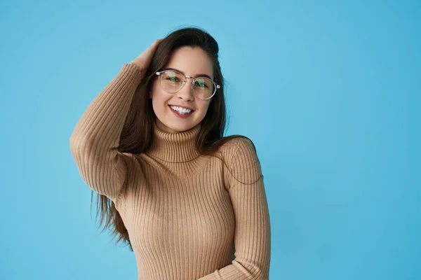 Smart Teenager Turtleneck Glasses Touching Long Dark Hair Looking Camera - Stock-foto