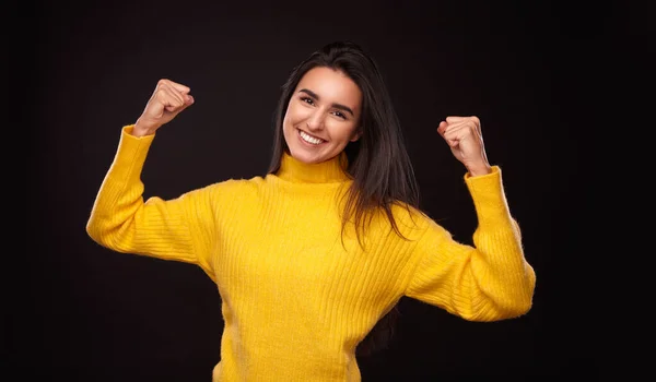 Cheerful Young Hispanic Woman Yellow Sweater Looking Camera Showing Biceps — Stock Photo, Image
