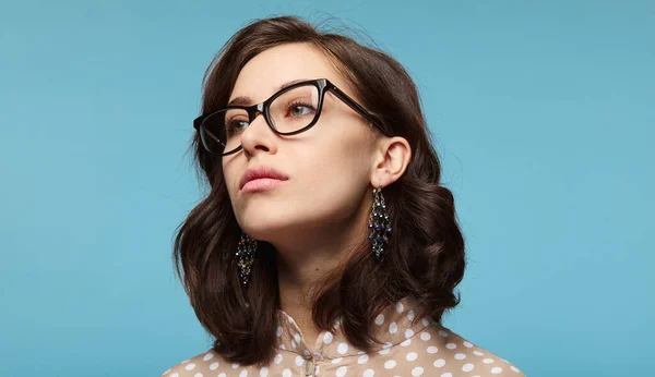 Smart Young Brunette Stylish Earrings Glasses Looking Away Blue Background — Photo