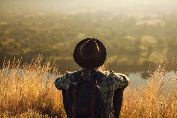 Back View Unrecognizable Male Tourist Checkered Shirt Hat Backpack Sitting — Stockfoto