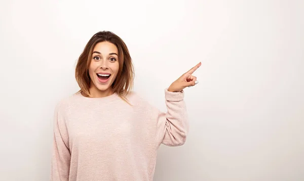 Astonished Young Female Sweatshirt Pointing Away Looking Camera Opened Mouth — Stock fotografie