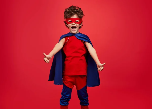 Happy Little Boy Superhero Costume Screaming Gesturing Thumbs Red Background — 스톡 사진