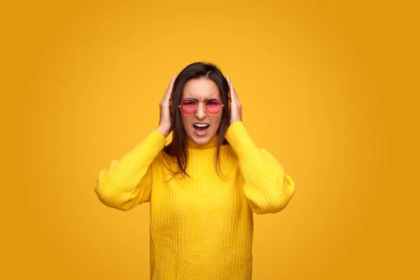 Angry Brunette Sweater Sunglasses Covering Ears Touching Headphones While Trying — Fotografie, imagine de stoc