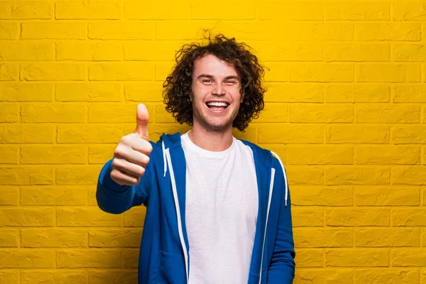 Cheerful Male Casual Clothes Curly Hair Smiling Gesturing Thump While — Φωτογραφία Αρχείου