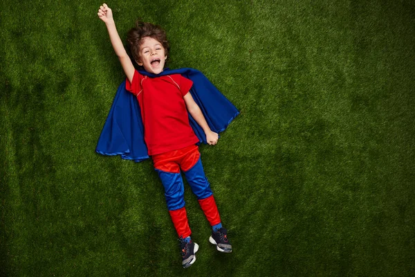 Top View Cheerful Little Boy Superhero Costume Raising Arm Screaming — Stockfoto