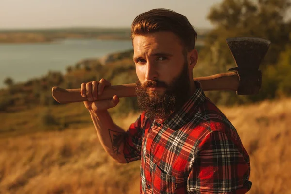 Bearded Male Woodcutter Checkered Shirt Tattooed Arm Carrying Axe Shoulder — Foto de Stock