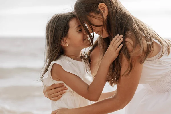 Loving Mom White Dress Embracing Happy Child While Spending Time — Stok Foto