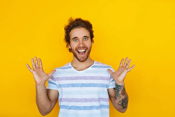 Merry Young Man Striped Shirt Raising Arms Yelling Excitement Yellow — Fotografia de Stock