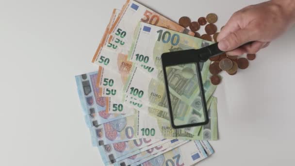Checking Counterfeit Money Magnifying Glass Checking Euro Banknotes — Video Stock
