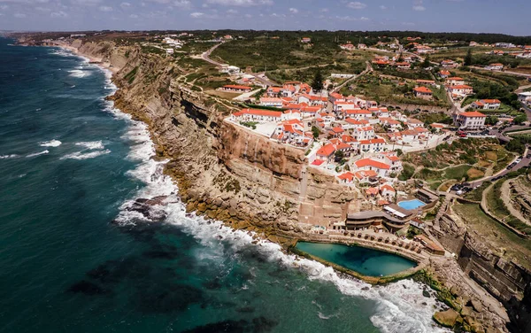 Small Portuguese village situated on edge of steep cliff in a stunning location on coastline. Praia das Azenhas do Mar