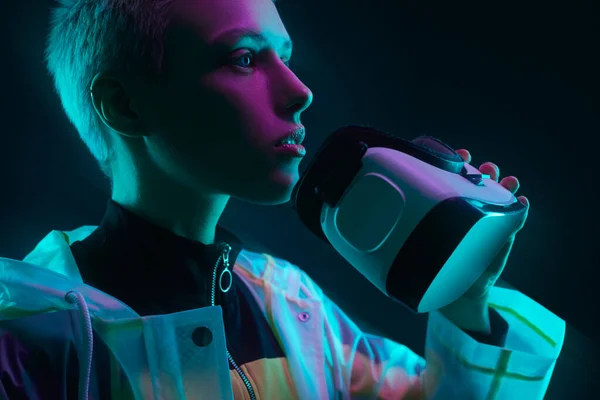 Young Futuristic Female Gamer Short Hair Taking Goggles Looking Away — 스톡 사진