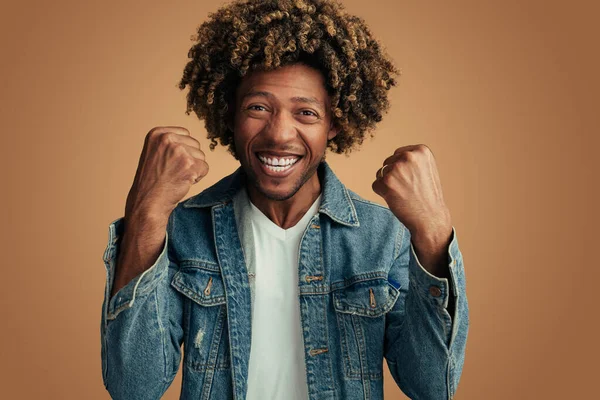 Happy African American Male Denim Jacket Curly Hair Clenching Fists — Stok fotoğraf