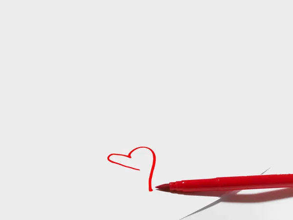The red heart is drawn with a felt-tip pen on white paper. Scarlet heart. Valentine\'s Day. Declaration of love.