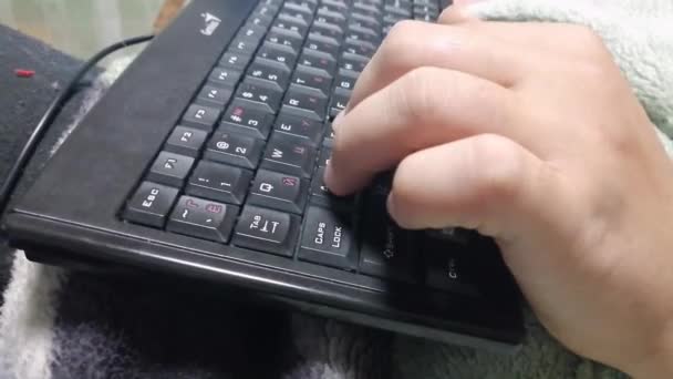 Man Hand Types Keyboard Keyboard His Lap Man Plays Game — стоковое видео