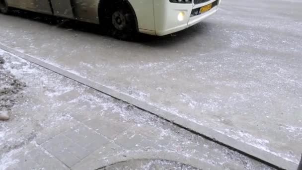 Bus Pulls Away Stop Fine Snow Blows Asphalt Wind Winter — Stock Video
