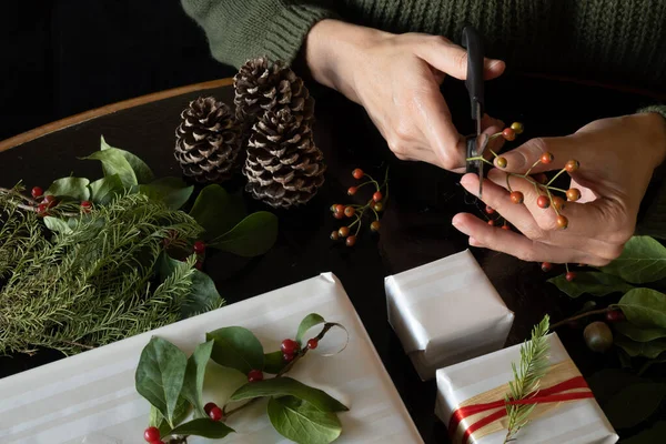 Woman Cutting Plant Pieces Decorate Christmas Gifts Copy Space — Stock Photo, Image