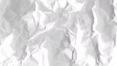 Stop Motion video with crumpled paper. 4k video with texture of distortions and fractures. Animation of the destroyed document.