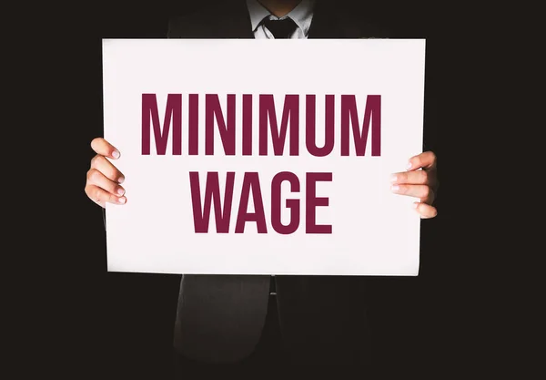 Minimum Wage Concept Background Employee Holding Cardboard — 图库照片