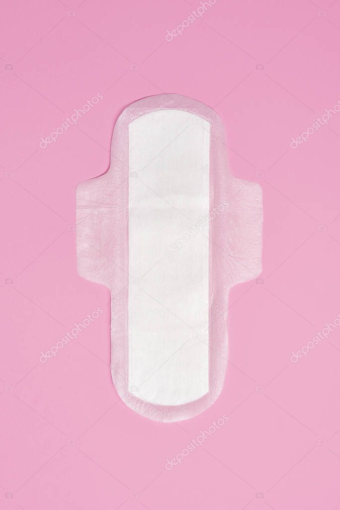 cotton sanitary napkin pad on pink background