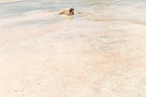 Pink sand on the beach. Pink beach.Photo