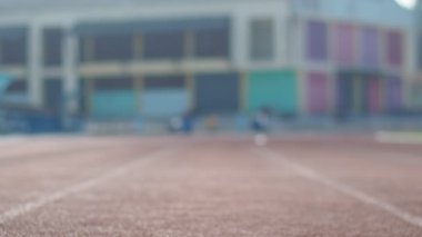 man Runner in a stadium on background